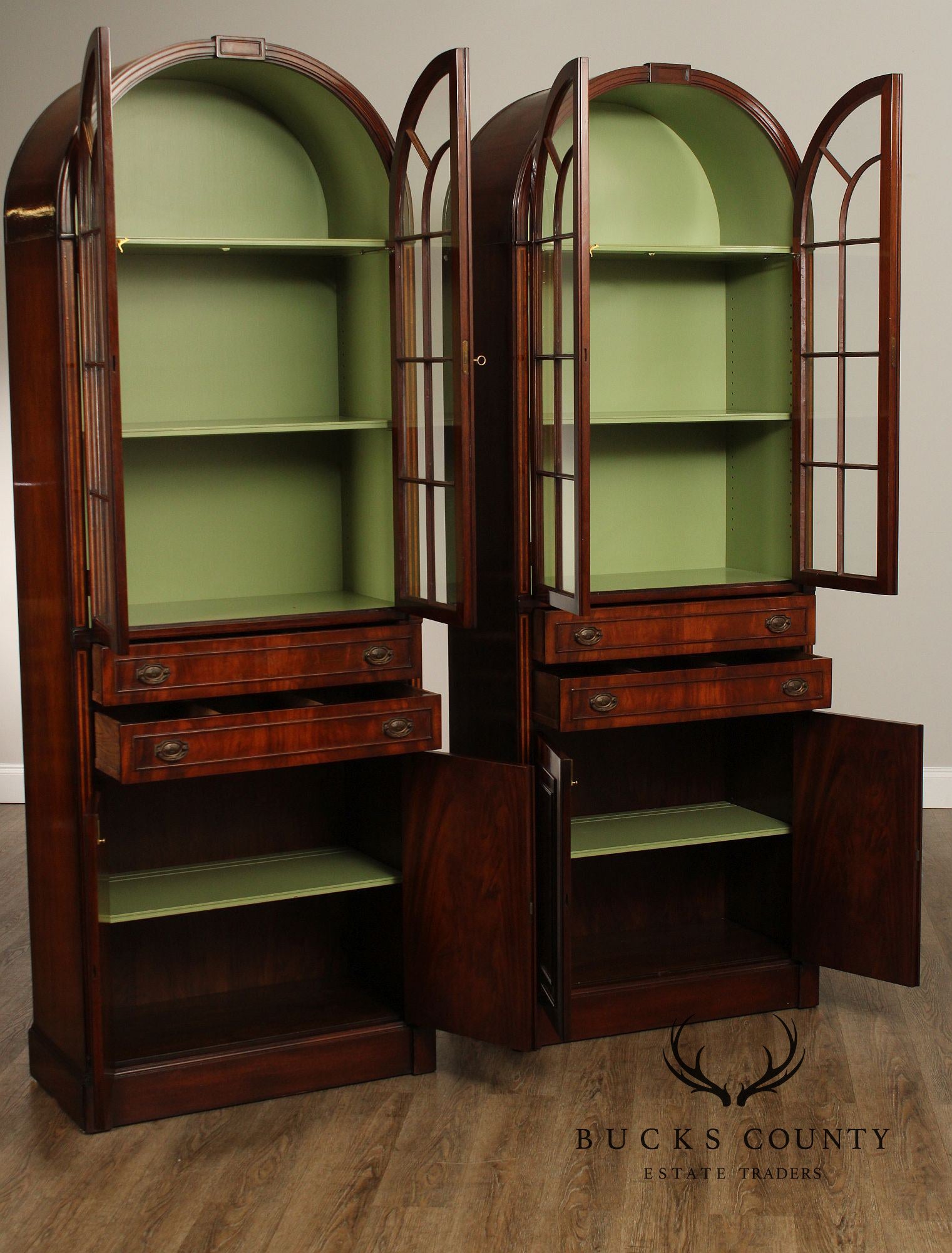 English Regency Style Pair of Mahogany Arched Glass Door Bookcases