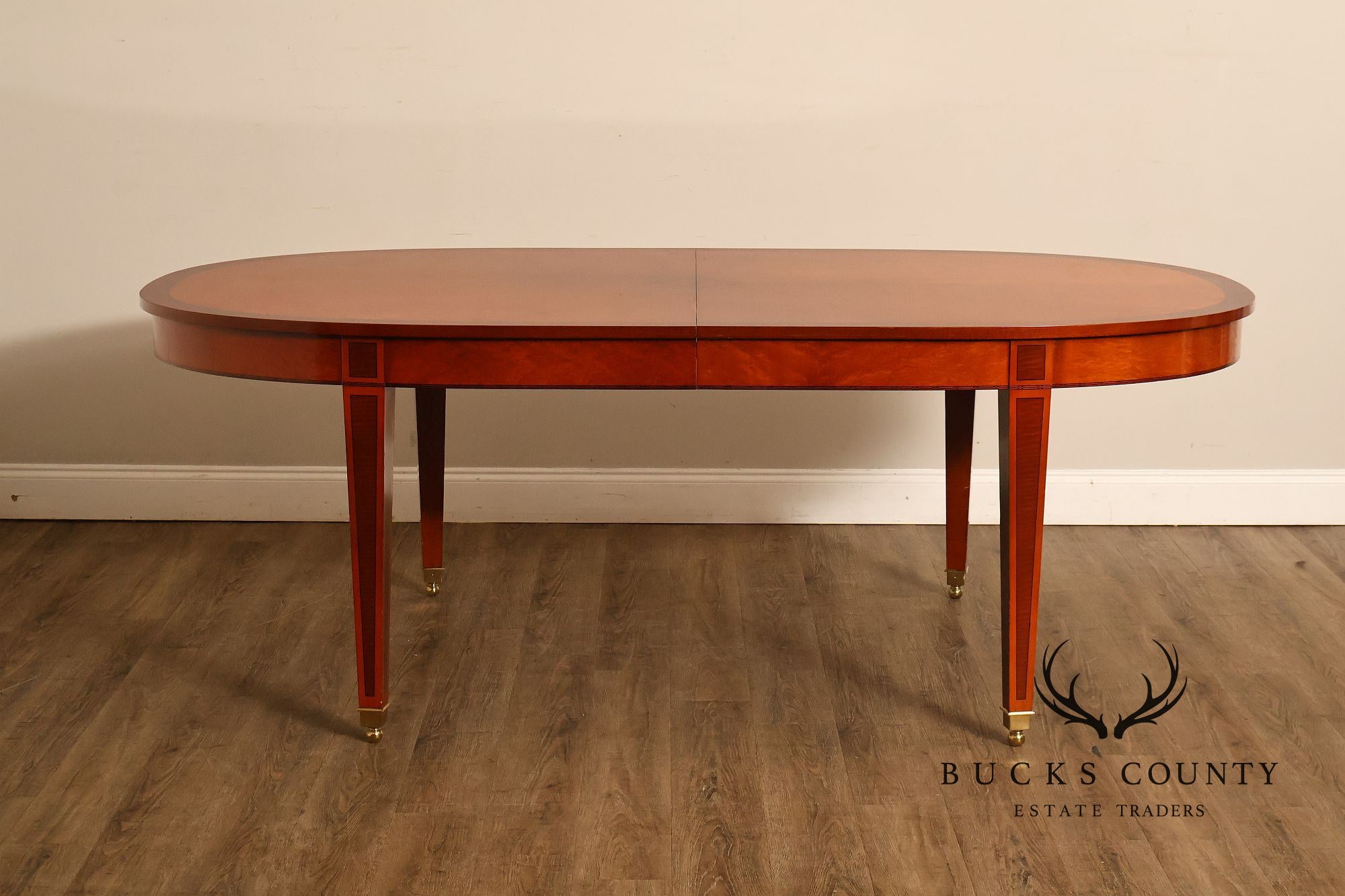 Kindel Kent Mahogany Banded Oval Dining Table with Three Leaves