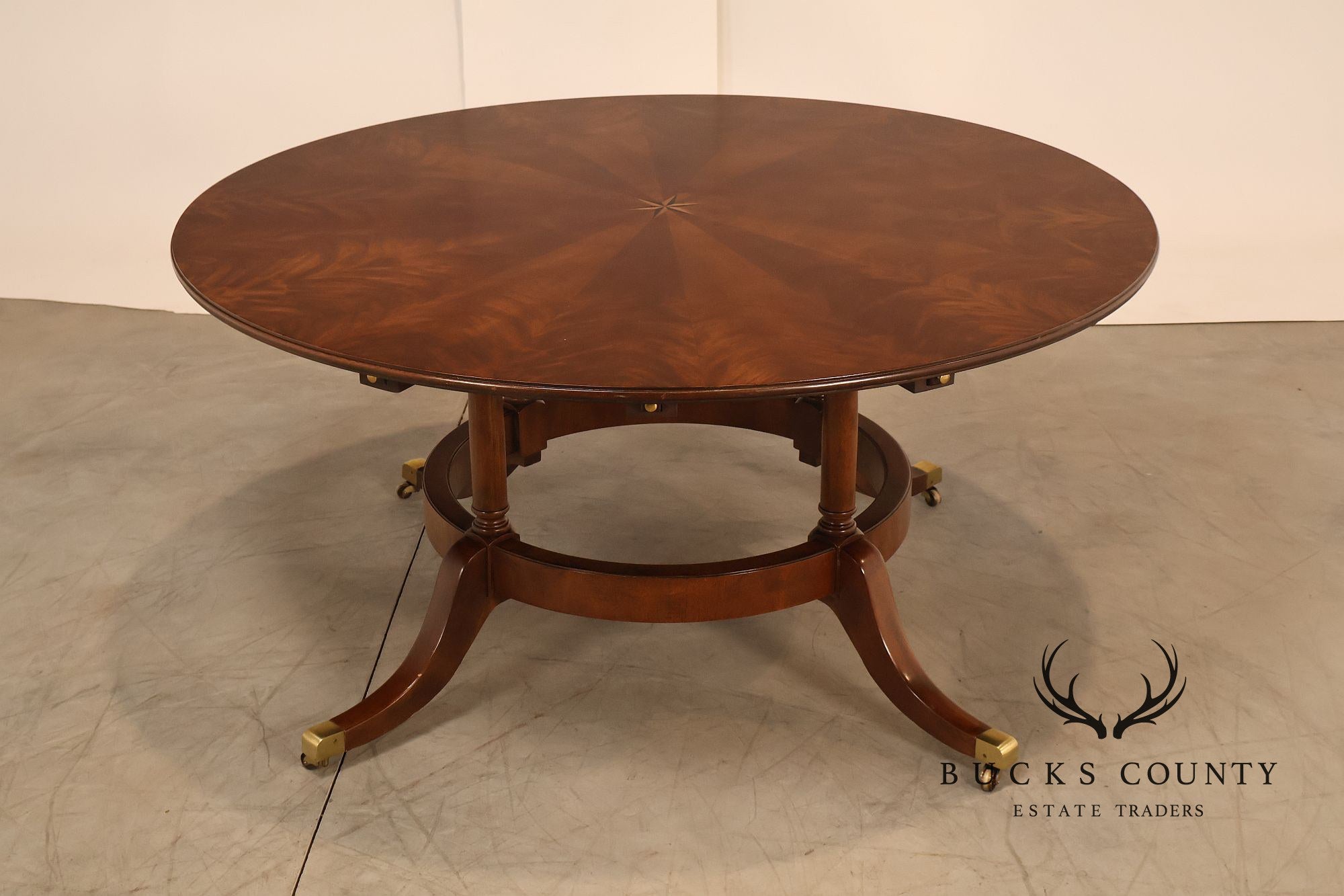 E.J. Victor Regency Style Round Inlaid Mahogany Pedestal Dining Table