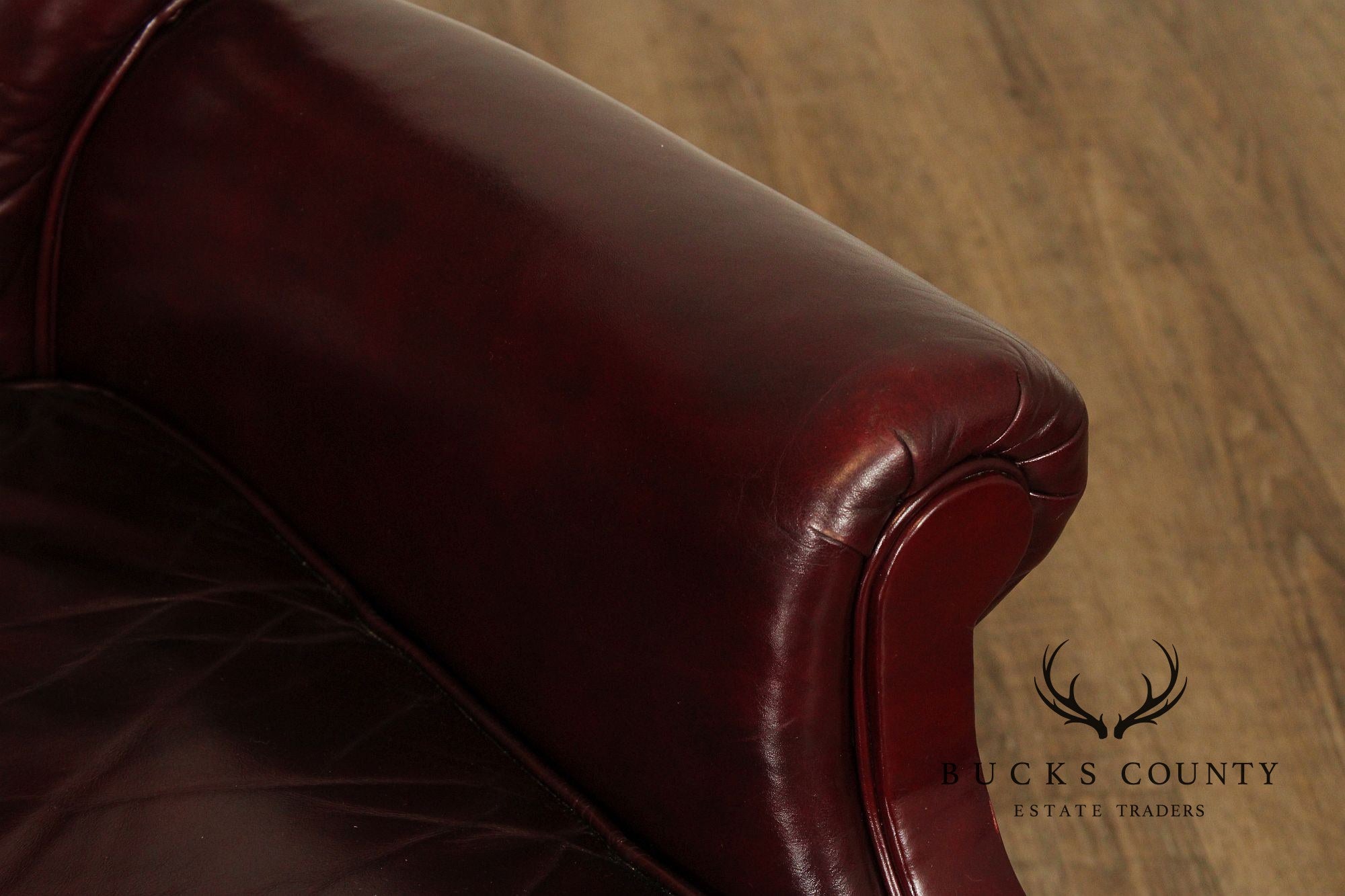 NORTH HICKORY OXBLOOD TUFTED LEATHER CHAIR AND OTTOMAN