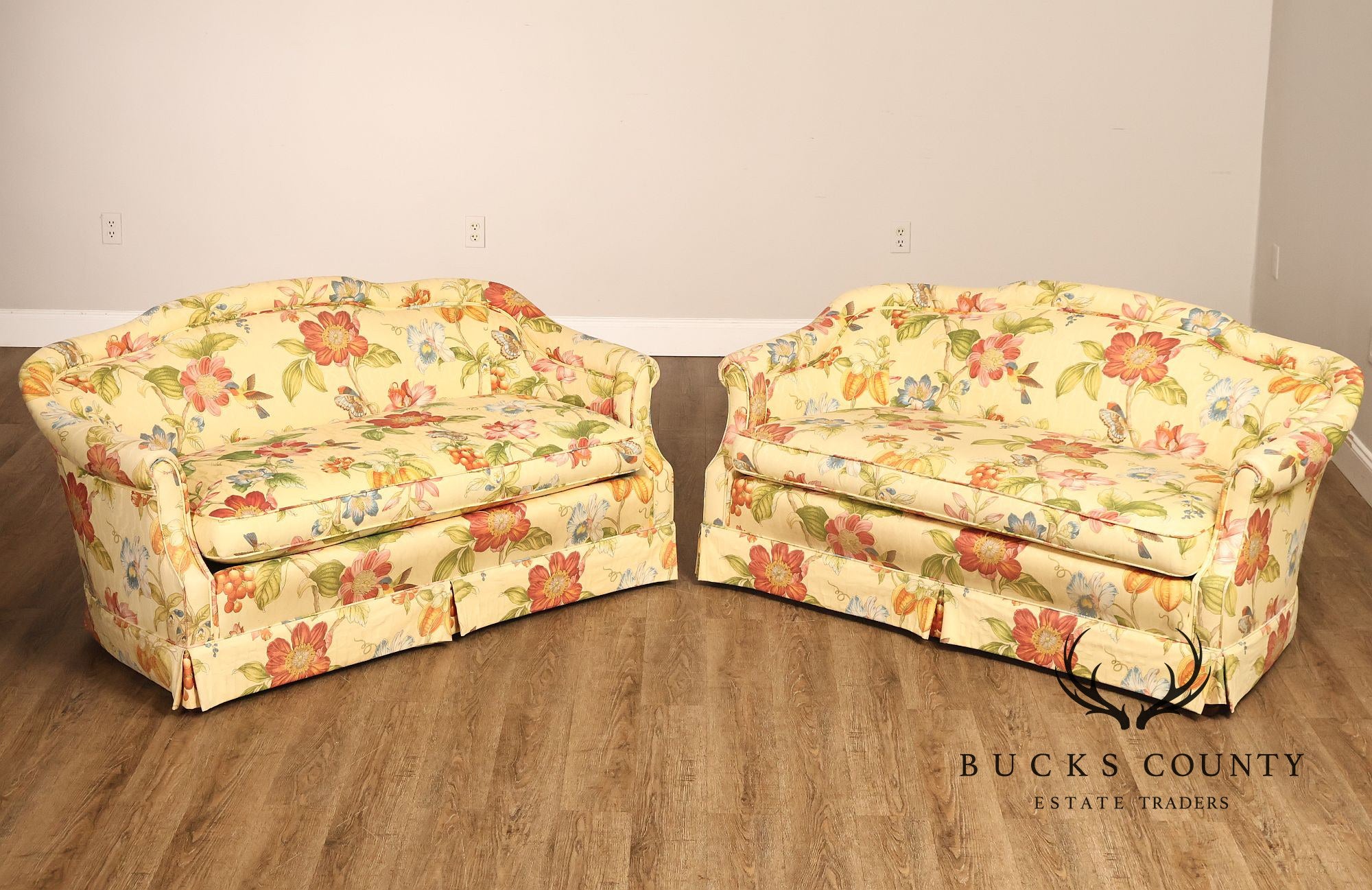 Custom Upholstered Pair Of Floral Chintz Skirted Loveseats