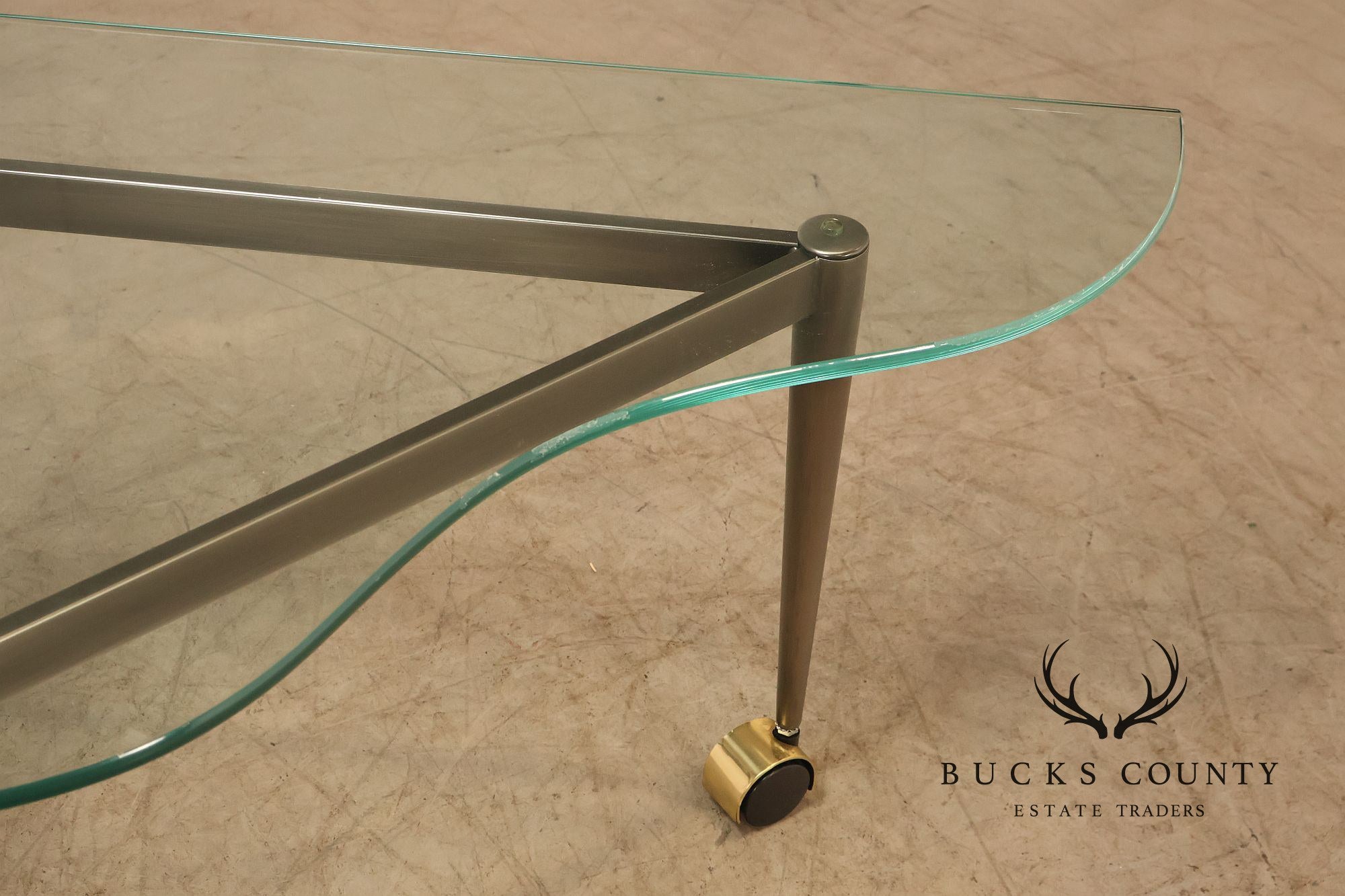 Postmodern Pair Of Triangular Glass Top Coffee Table with Brushed Steel Frame and Brass Casters
