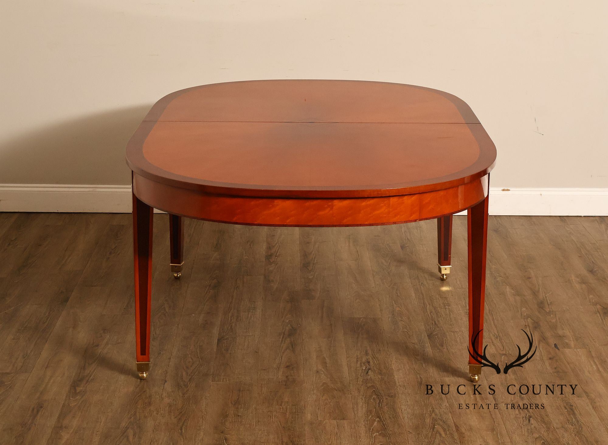 Kindel Kent Mahogany Banded Oval Dining Table with Three Leaves