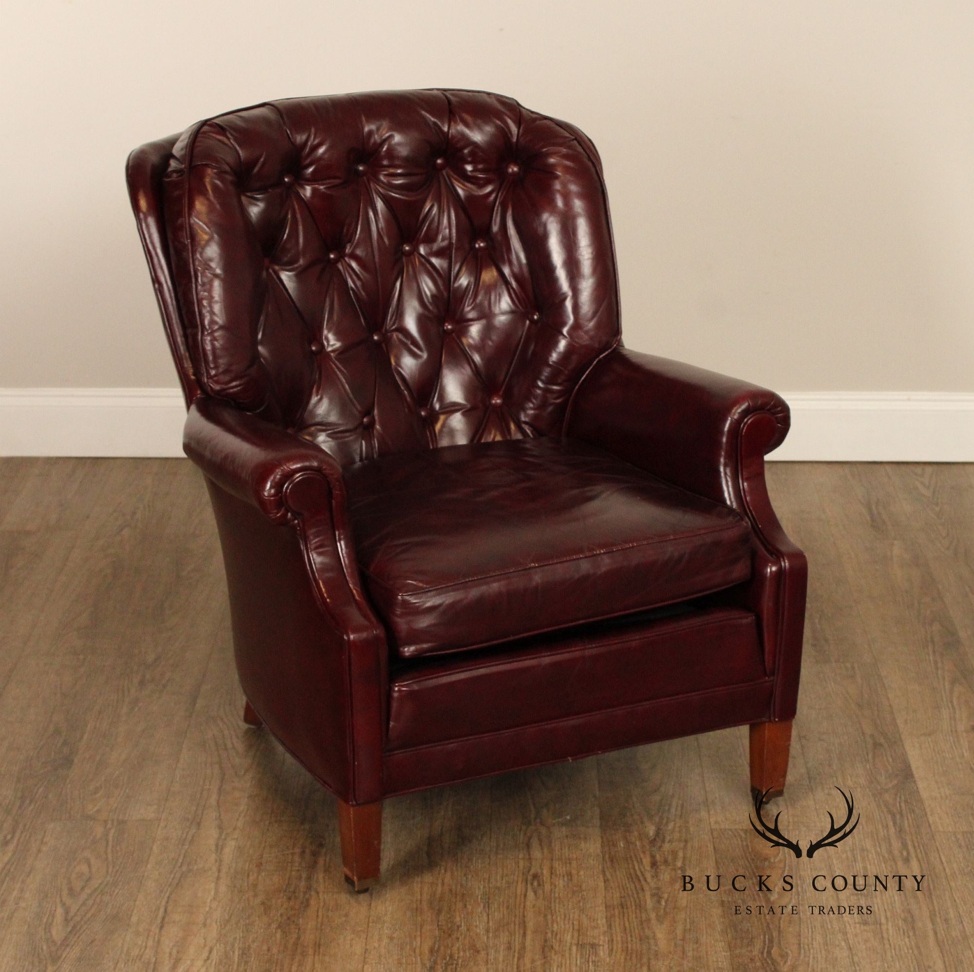 NORTH HICKORY OXBLOOD TUFTED LEATHER CHAIR AND OTTOMAN