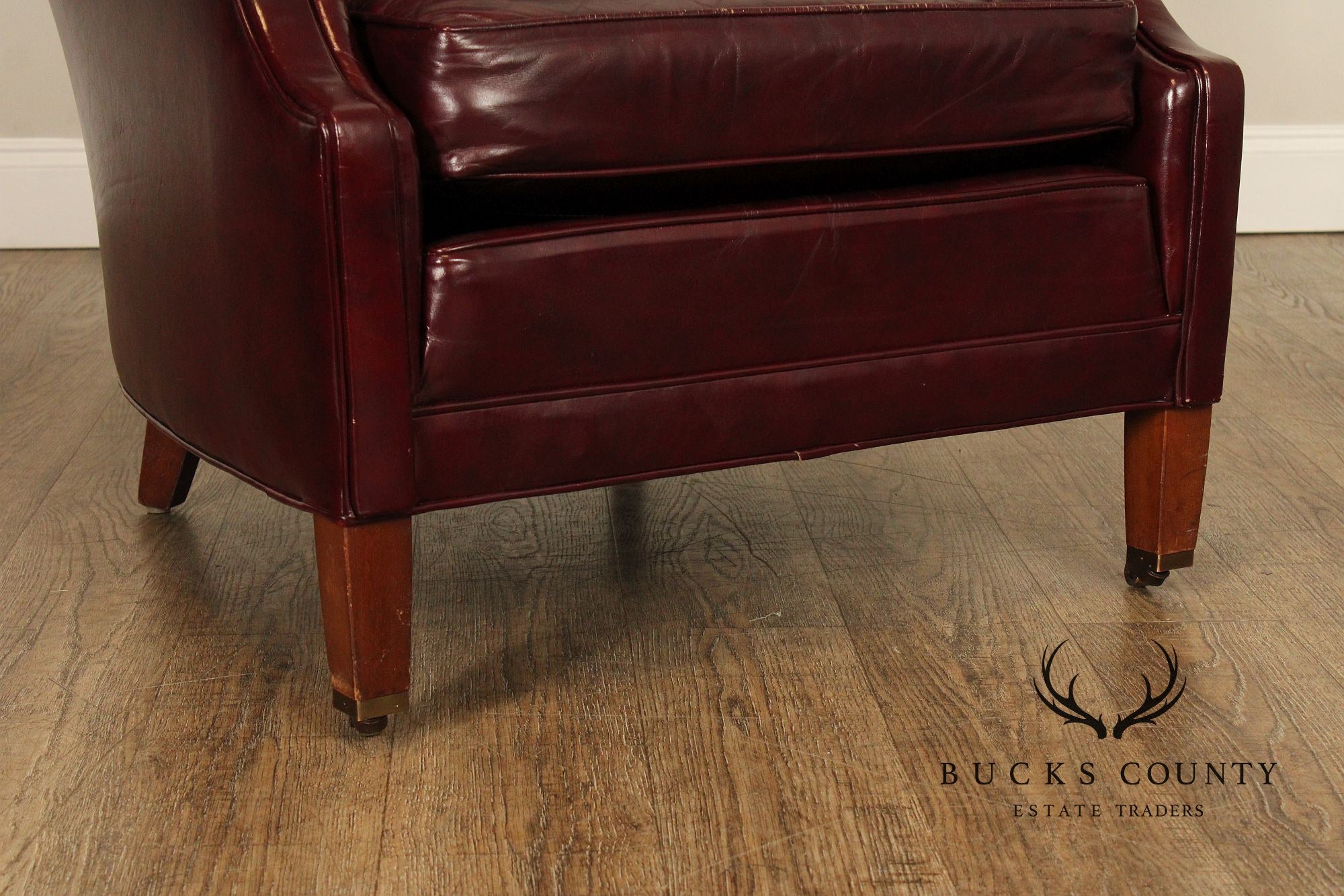 NORTH HICKORY OXBLOOD TUFTED LEATHER CHAIR AND OTTOMAN