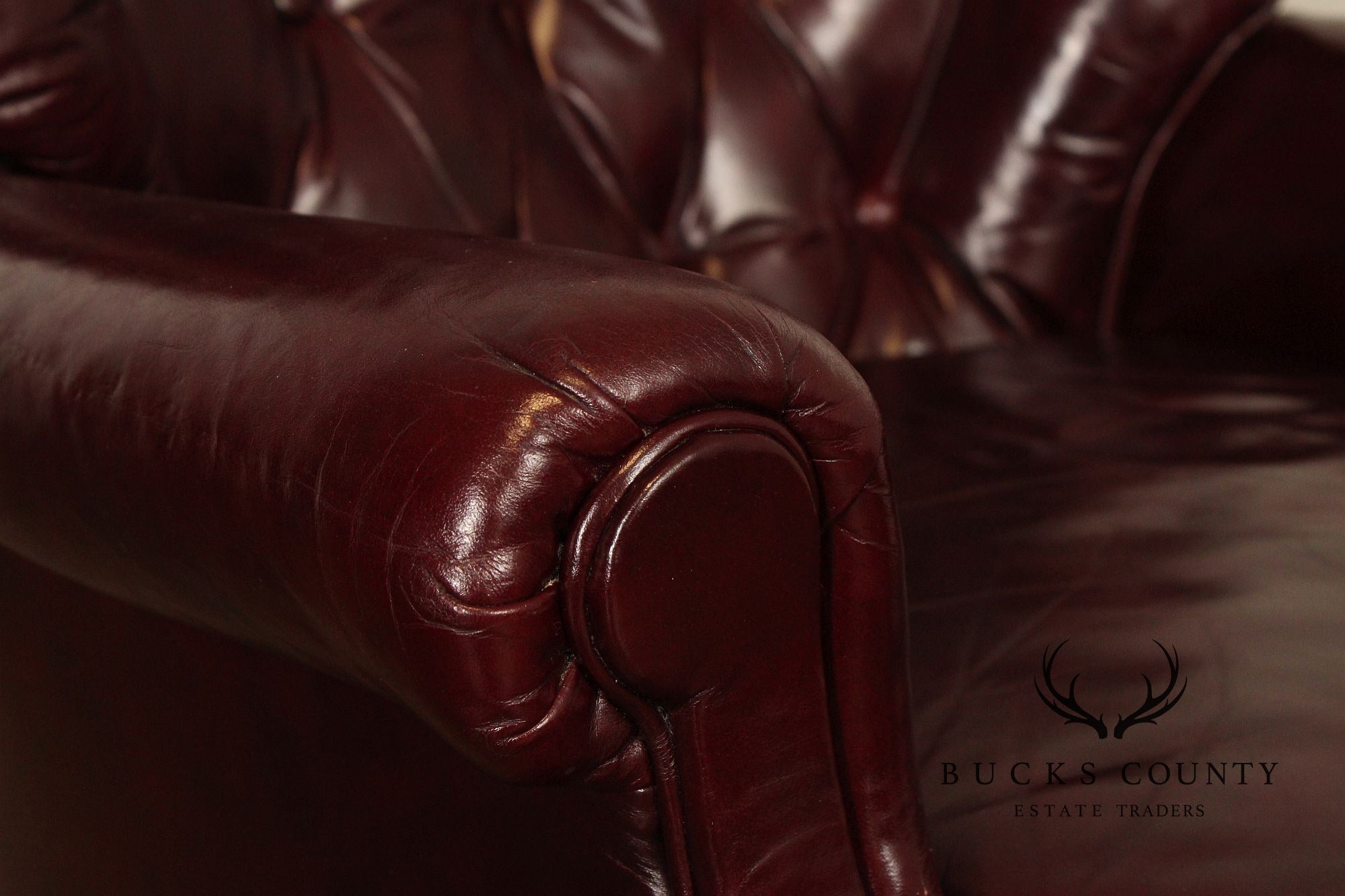 NORTH HICKORY OXBLOOD TUFTED LEATHER CHAIR AND OTTOMAN