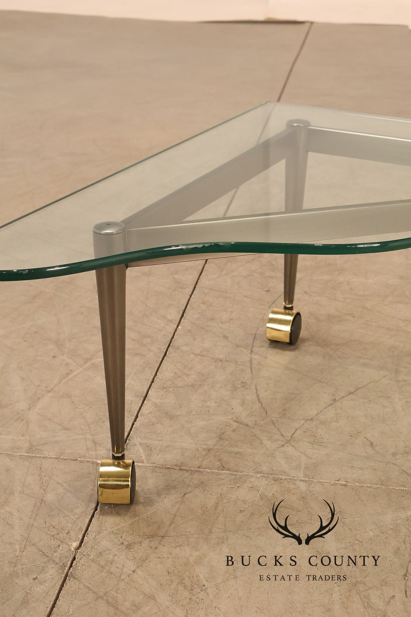 Postmodern Pair Of Triangular Glass Top Coffee Table with Brushed Steel Frame and Brass Casters