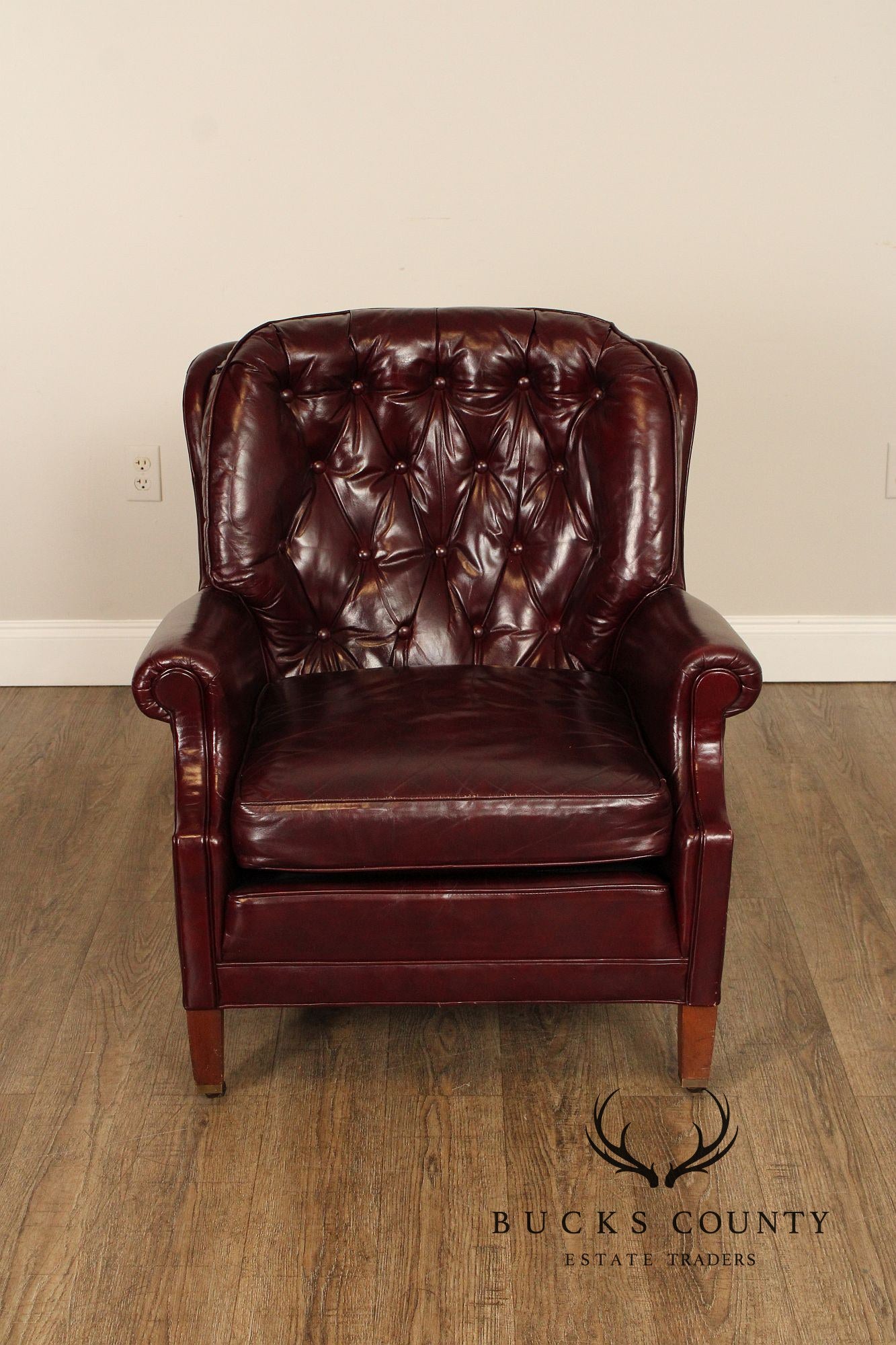 NORTH HICKORY OXBLOOD TUFTED LEATHER CHAIR AND OTTOMAN