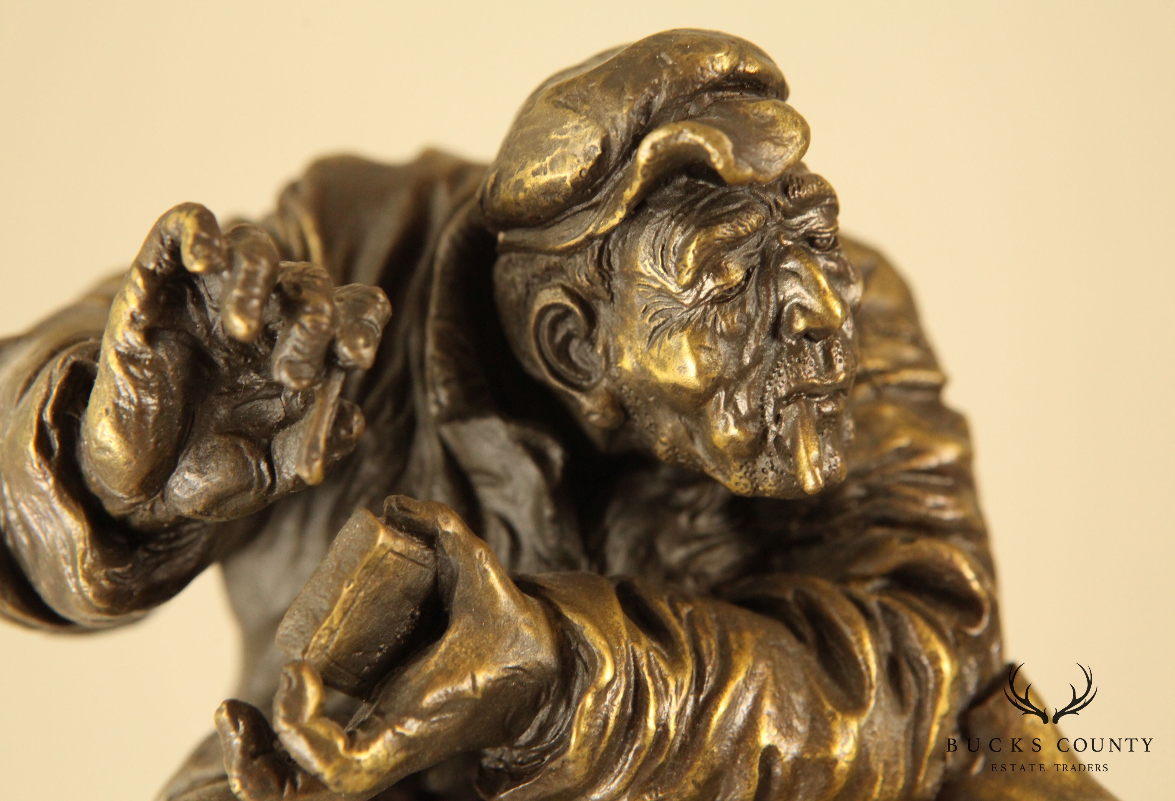 Atlie Bronze Figure of an Older Man Crouching, Reading, Striking Match