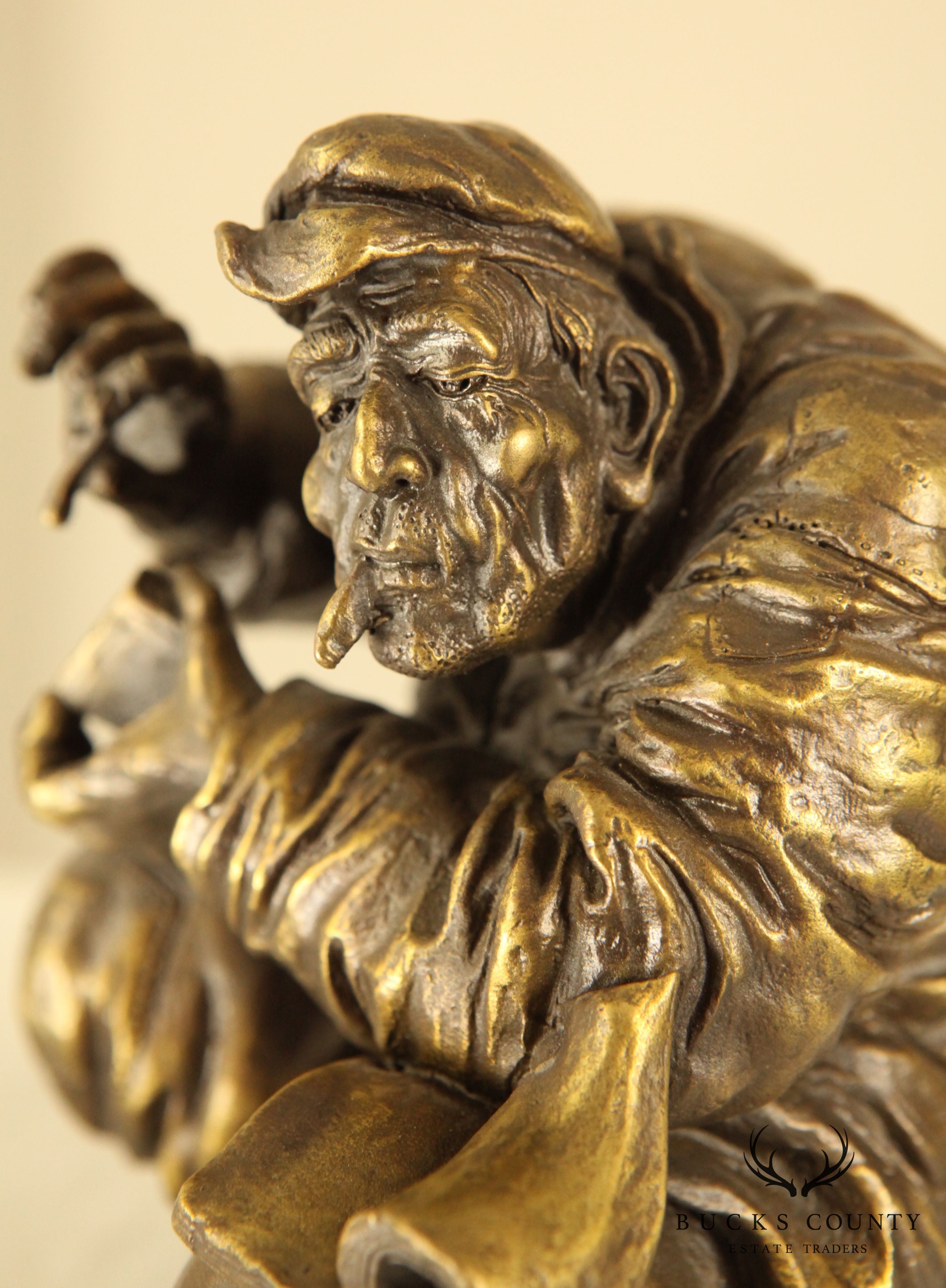 Atlie Bronze Figure of an Older Man Crouching, Reading, Striking Match