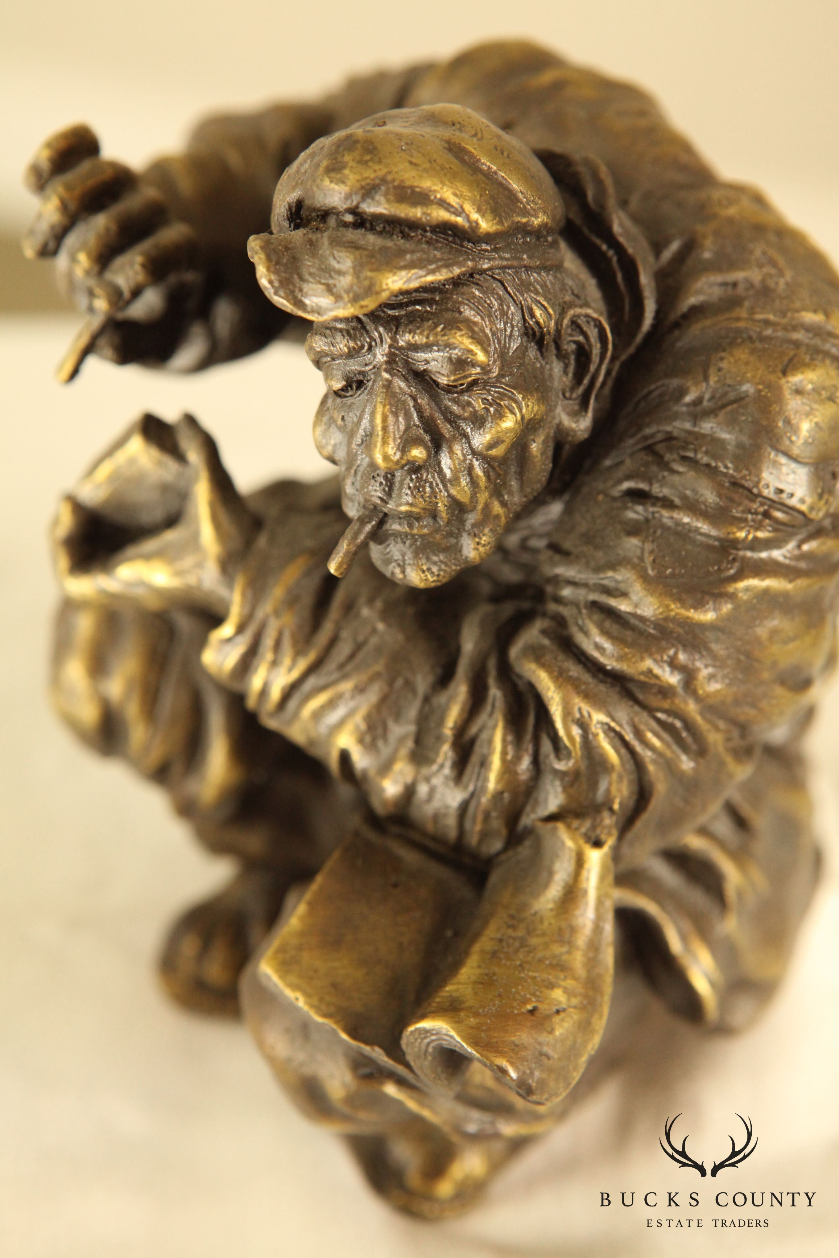 Atlie Bronze Figure of an Older Man Crouching, Reading, Striking Match (A)