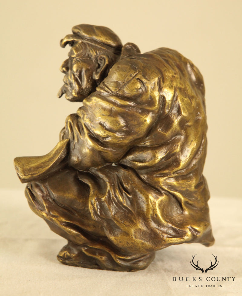 Atlie Bronze Figure of an Older Man Crouching, Reading, Striking Match