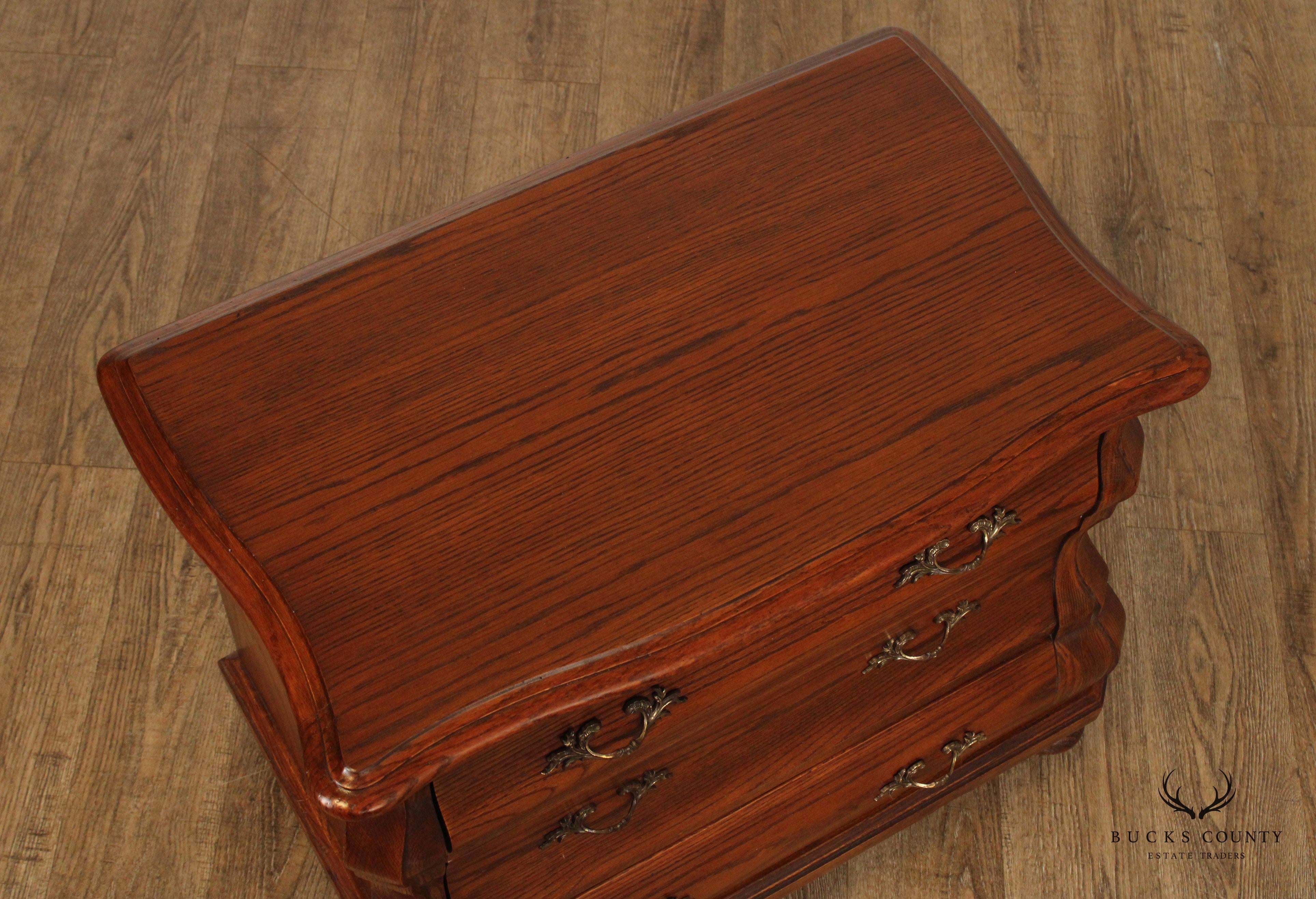 HEKMAN BAROQUE STYLE PAIR OF OAK BOMBE CHEST NIGHTSTANDS