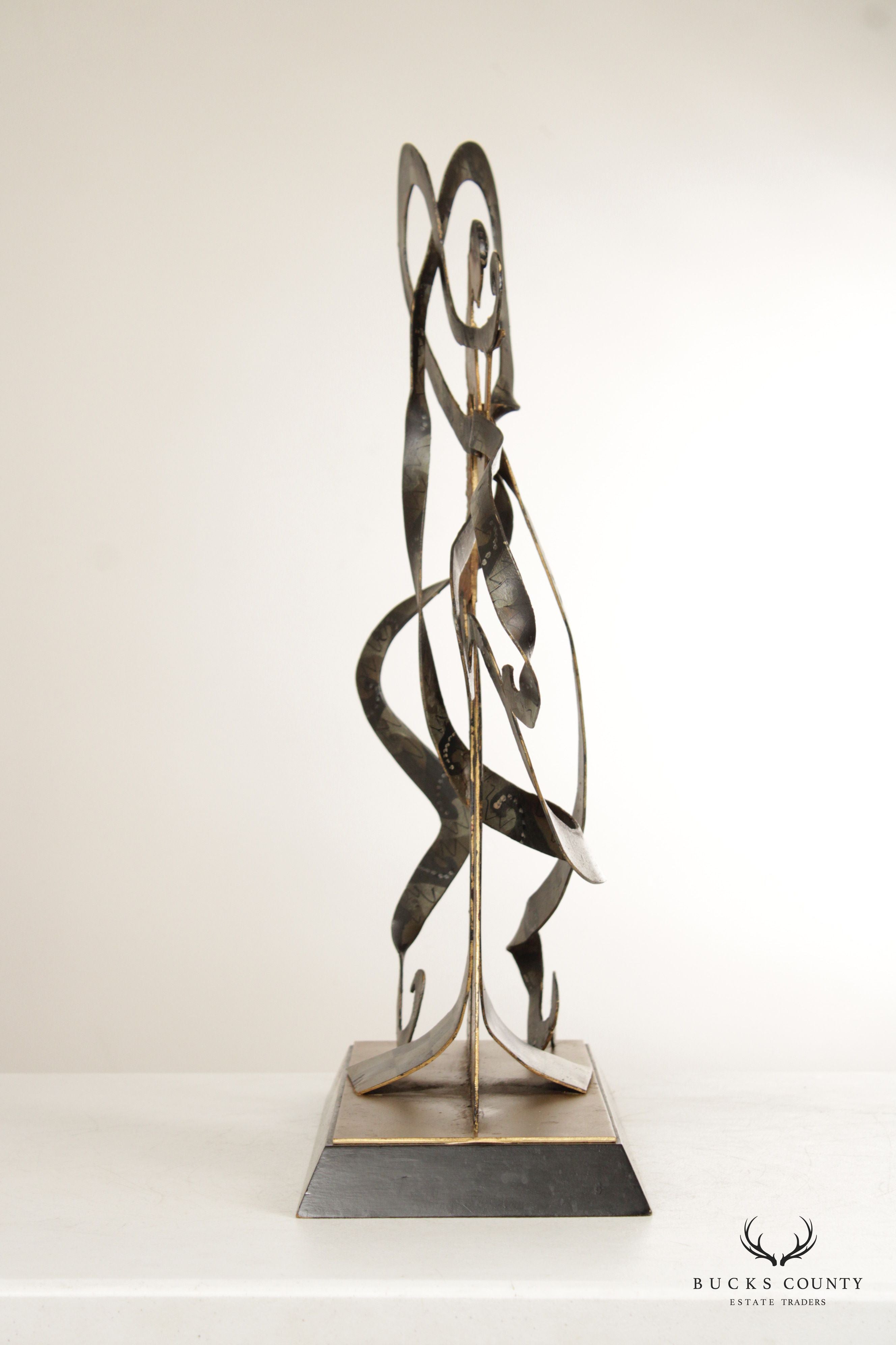 CONTEMPORARY METAL SCULPTURE OF WOMAN WITH RIBBONS