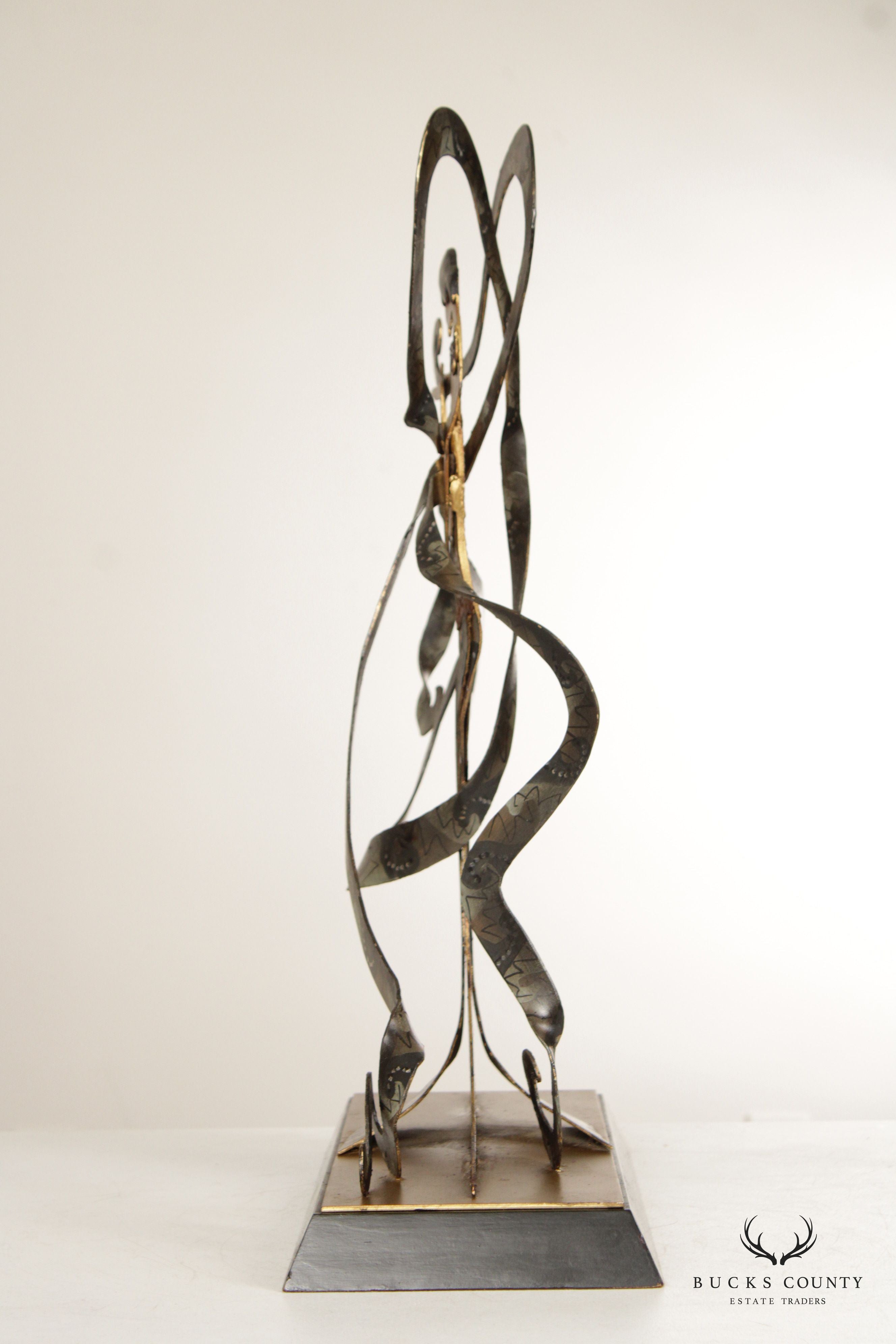 CONTEMPORARY METAL SCULPTURE OF WOMAN WITH RIBBONS